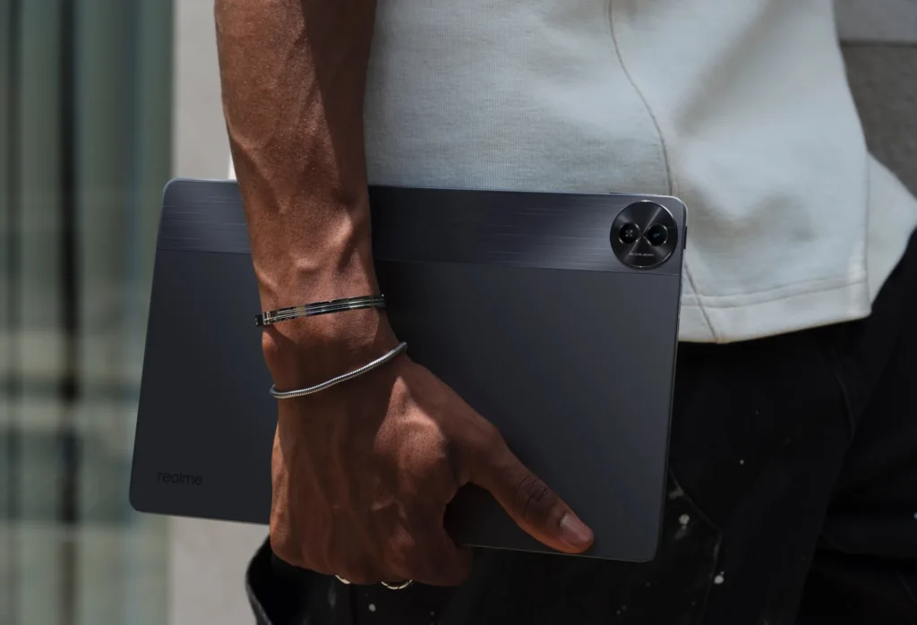 realme Pad 2, in Imagination Grey, carried at the side