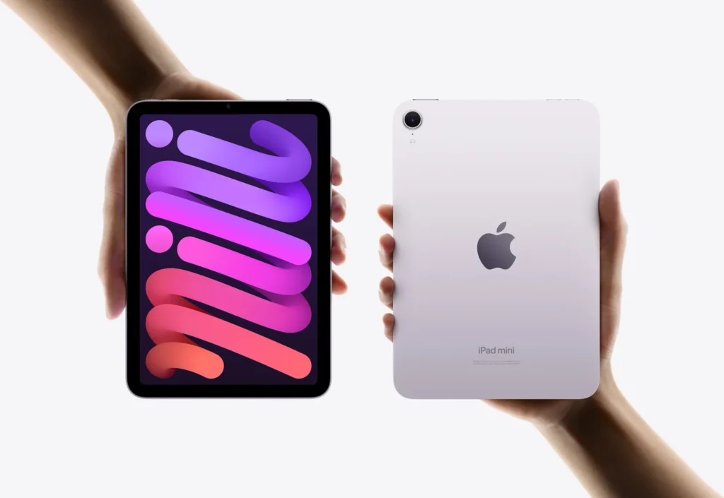 Apple iPad mini (A17 Pro), in Purple, front and back, held in two hands