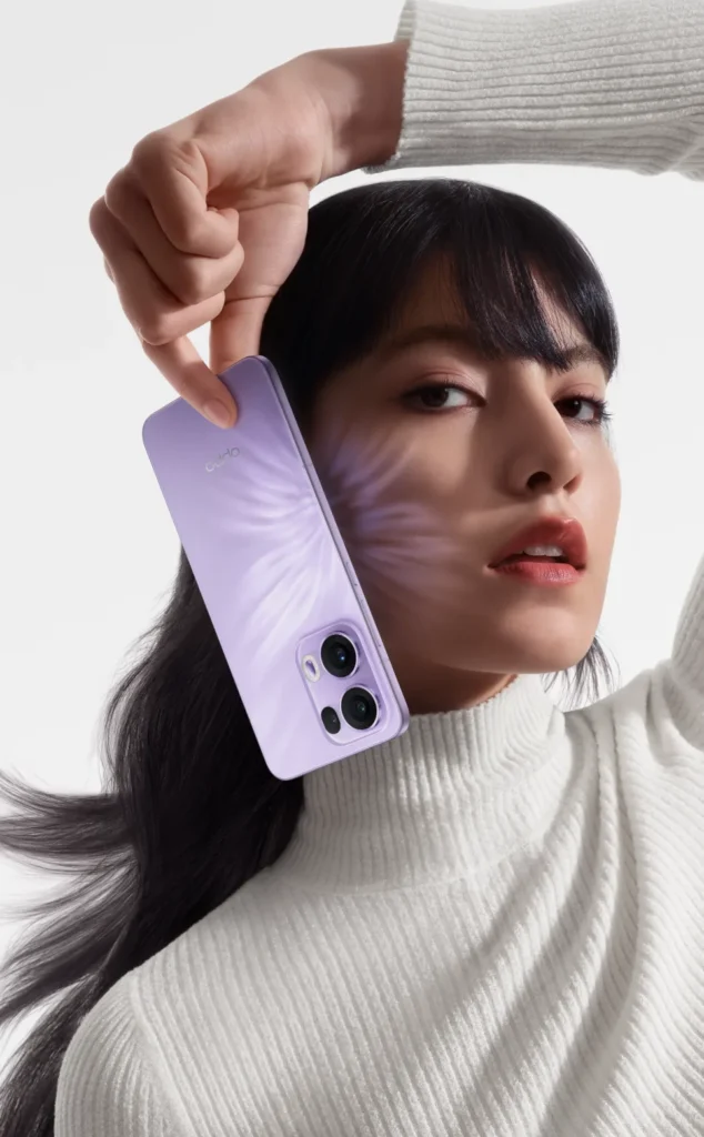 OPPO Reno13 Pro 5G, in Mist Lavender, held to the face