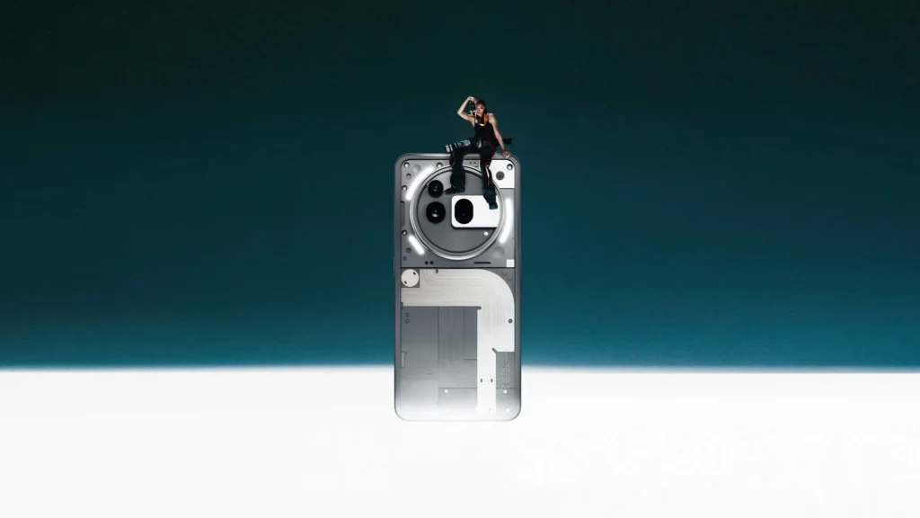 Nothing Phone (3a) Pro, in Grey, with a dancer sitting on top