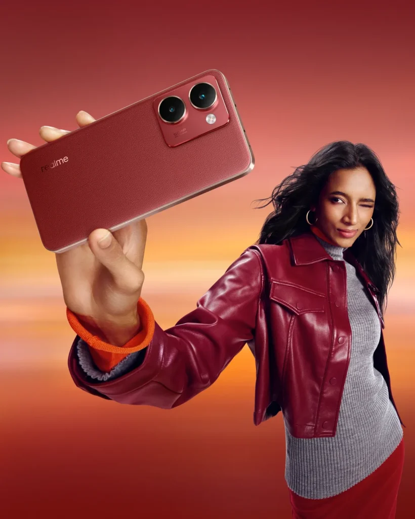 realme P3 Ultra 5G, in Orion Red, held up by a woman