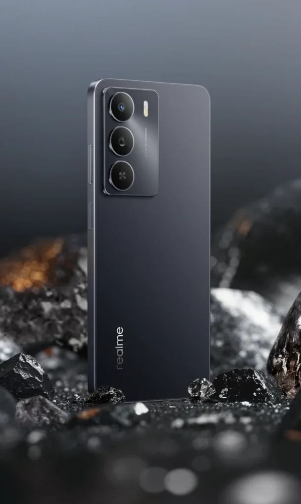 realme C73 5G, in Onyx Black, among dark rocks