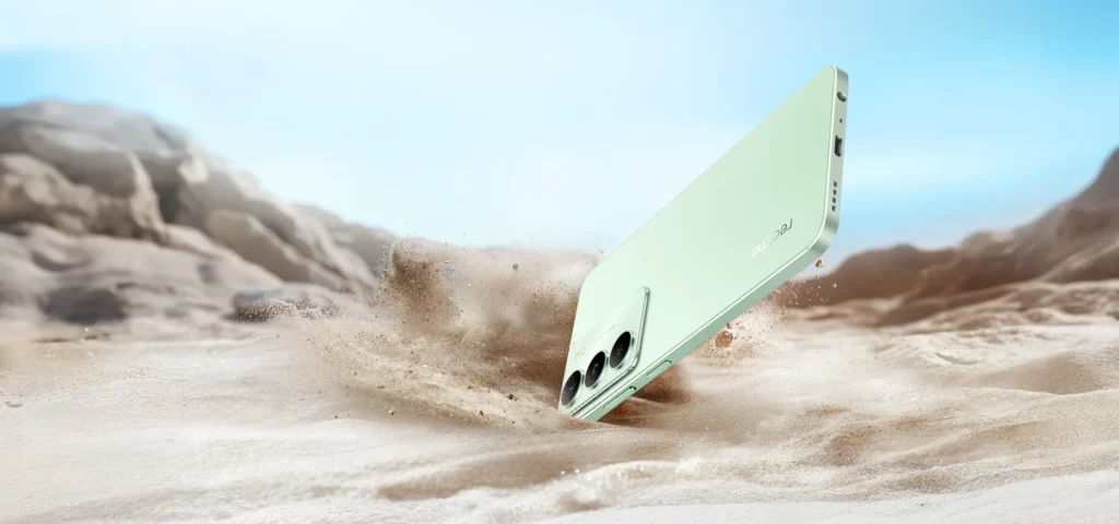 realme C73 5G, in Jade Green, over a sand dune