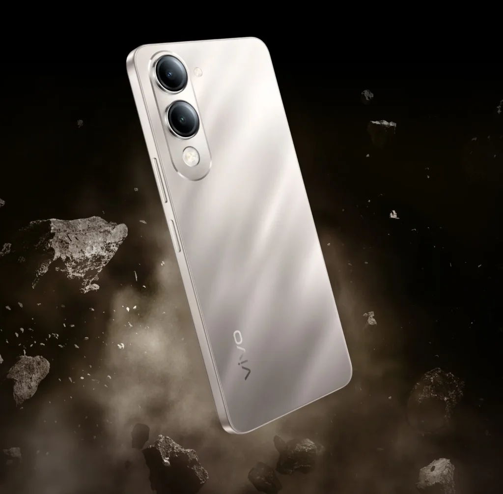 Vivo T4 Lite 5G, in Titanium Gold, with debris flying around it