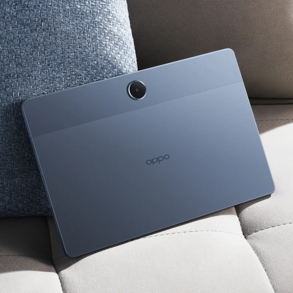 OPPO Pad SE, in Twilight Blue, from the back, resting on a sofa