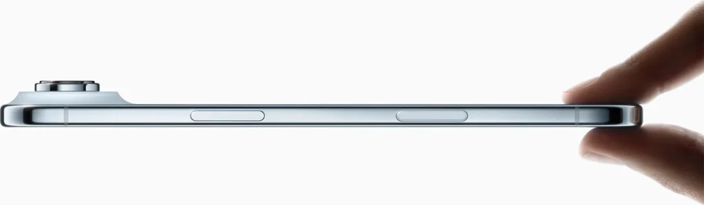 Apple iPhone Air, held between two fingers to show its thin side profile