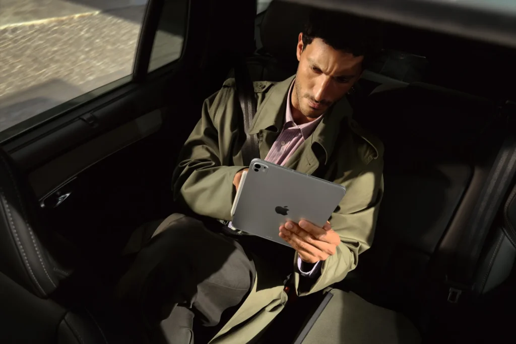 Apple iPad Pro 13″ (M5), in Silver, used in the back seat of a car