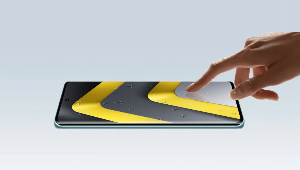 Poco M8 5G, screen-up, with a finger on the display