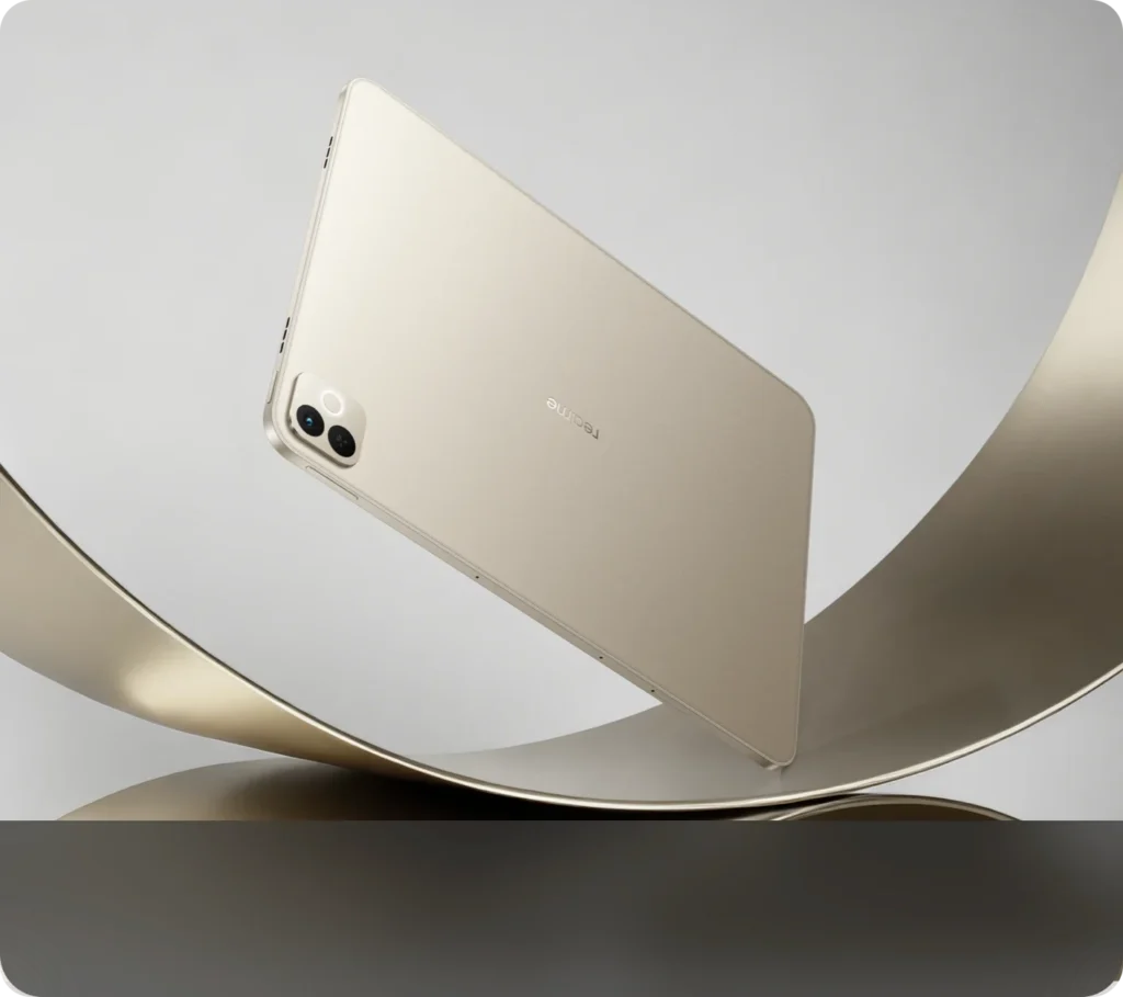 realme Pad 3, in Champagne Gold, from the back, resting on a gold ribbon