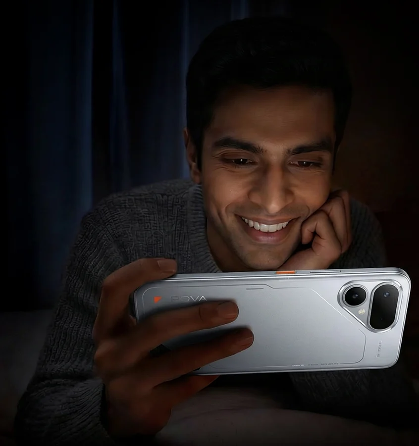TECNO POVA CURVE 2 5G, in Melting Silver, held sideways by a smiling man