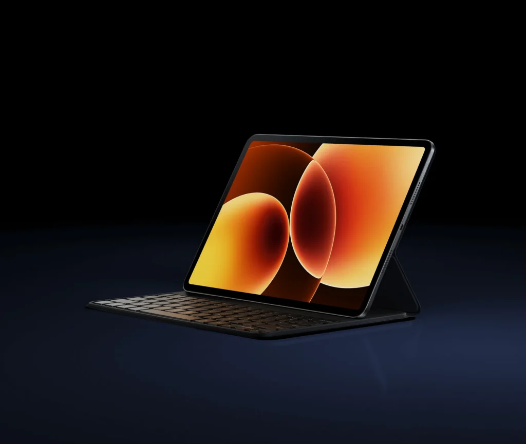 Xiaomi Pad 8, on the keyboard case at an angle, orange wallpaper on screen