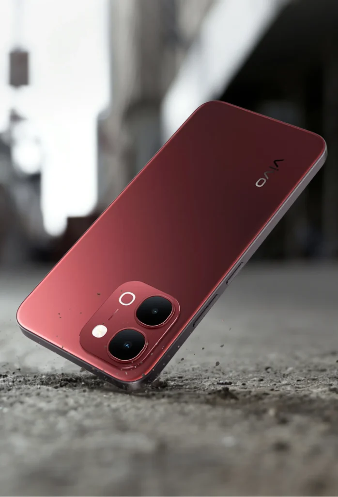 Vivo Y51 Pro 5G, in Festive Red, lying on rough ground