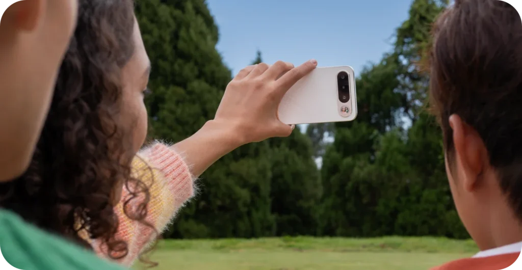 realme 16 5G, in Air White, taking a photo with the rear camera