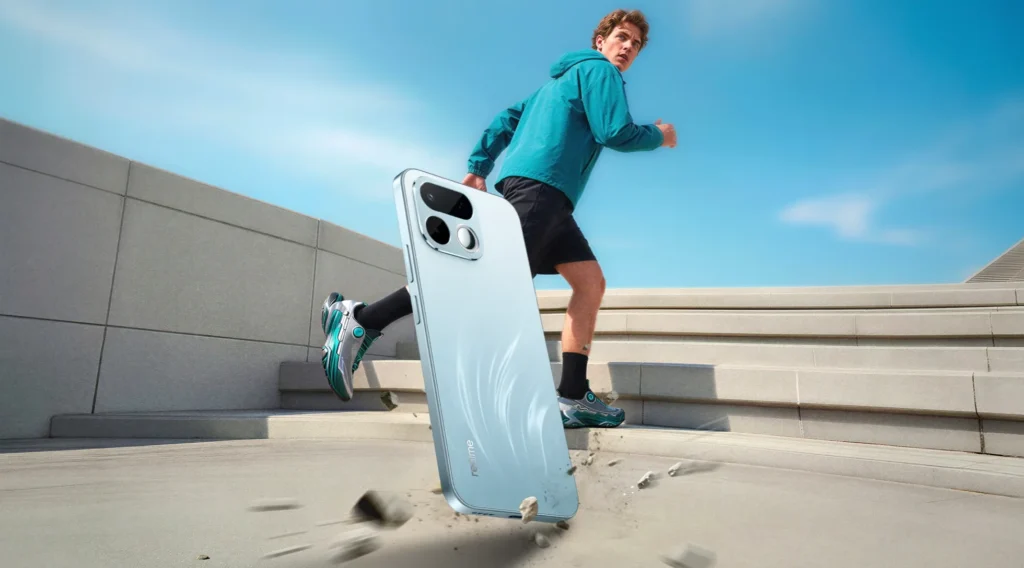 realme 16T 5G, in Aurora Green, falling on a stairway