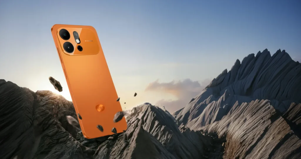 itel A100 Pro, in Comet Orange above mountain peaks