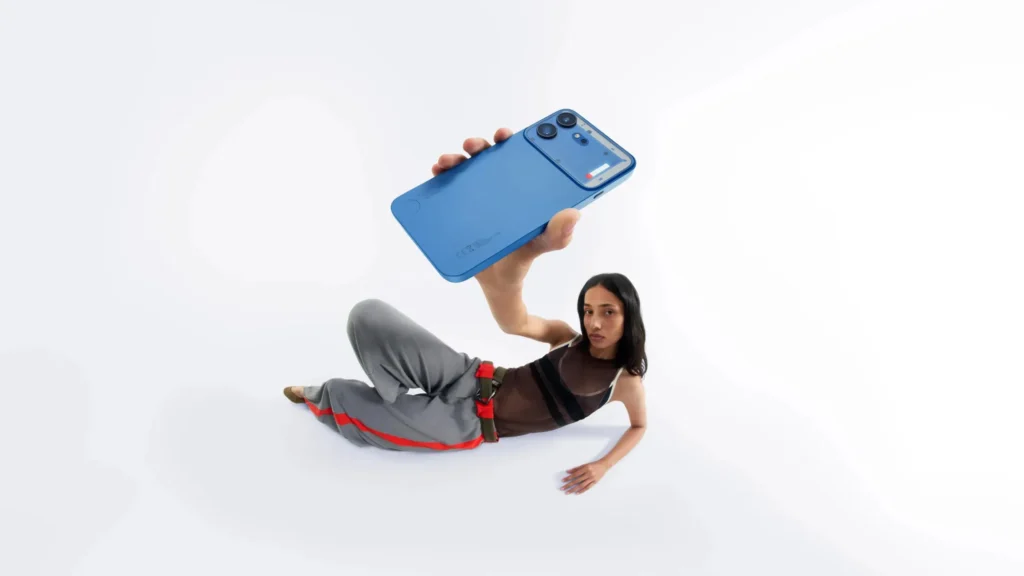 Nothing Phone (4b), in Blue, held overhead