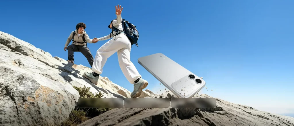 realme C100i, with hikers on a rocky hillside