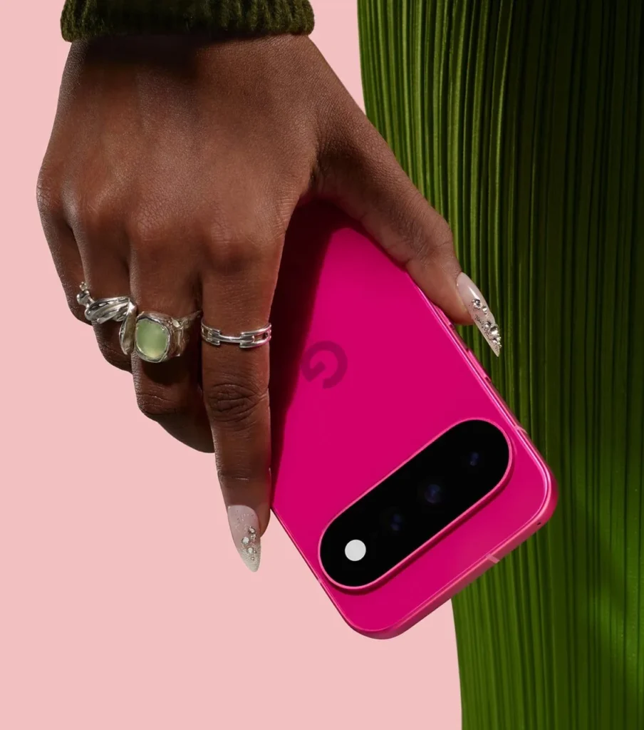 Google Pixel 11, in Hibiscus, held in hand