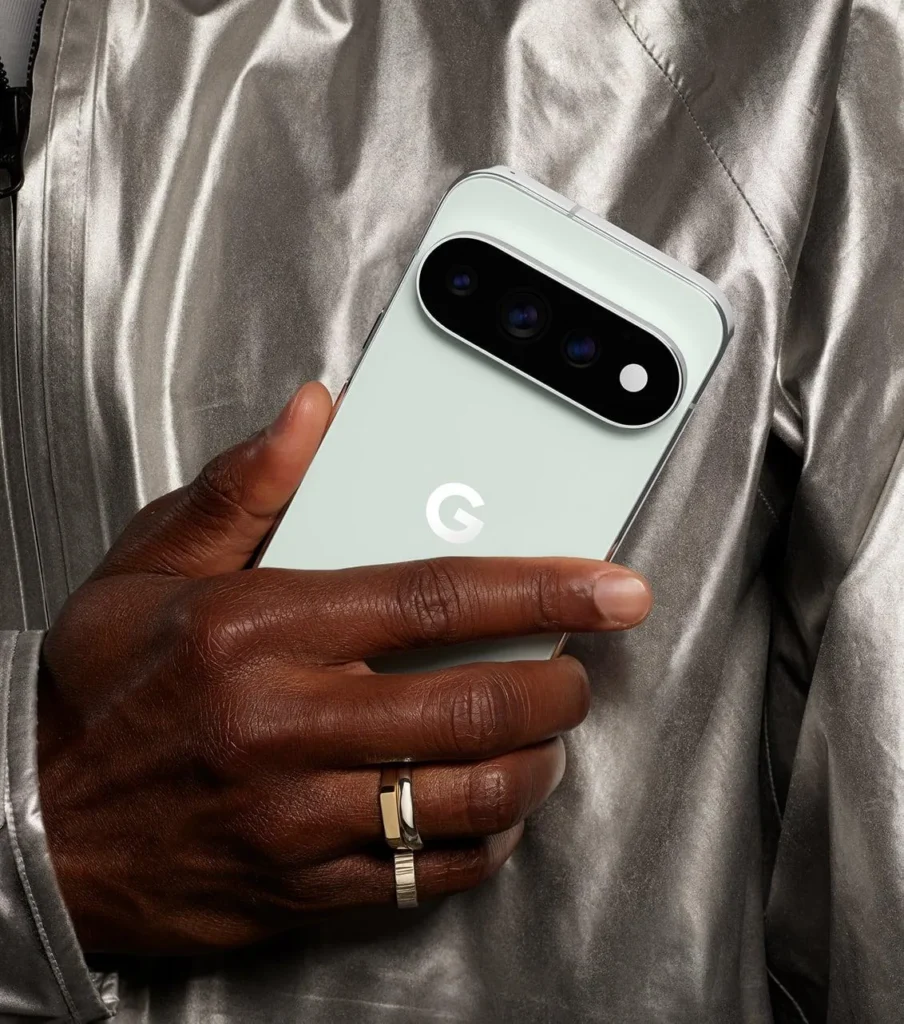Google Pixel 11 Pro, in Fog, held in hand