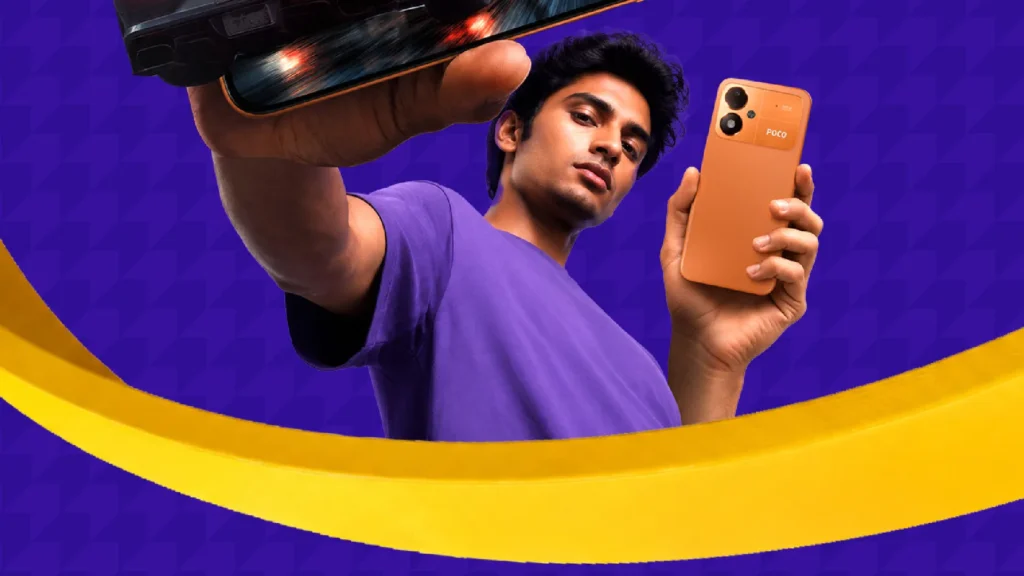 POCO M8 Power, in Blaze Orange, held up by a man