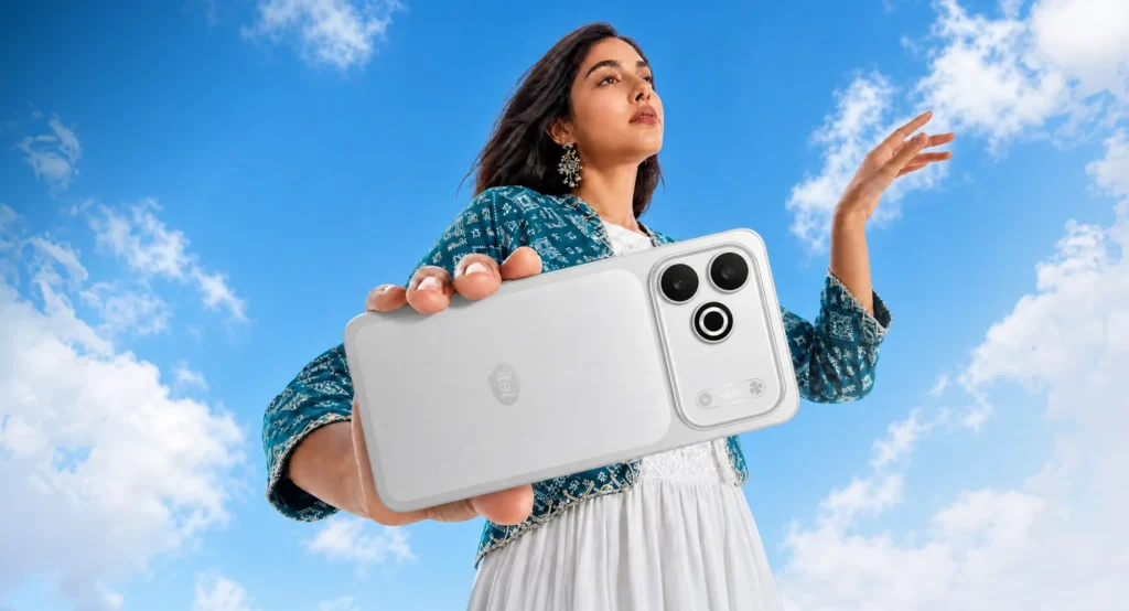 itel Zeno 300, in Silver Mist, held out against the sky