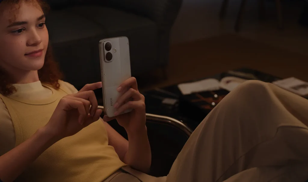 Poco X8, held up to take a photo indoors