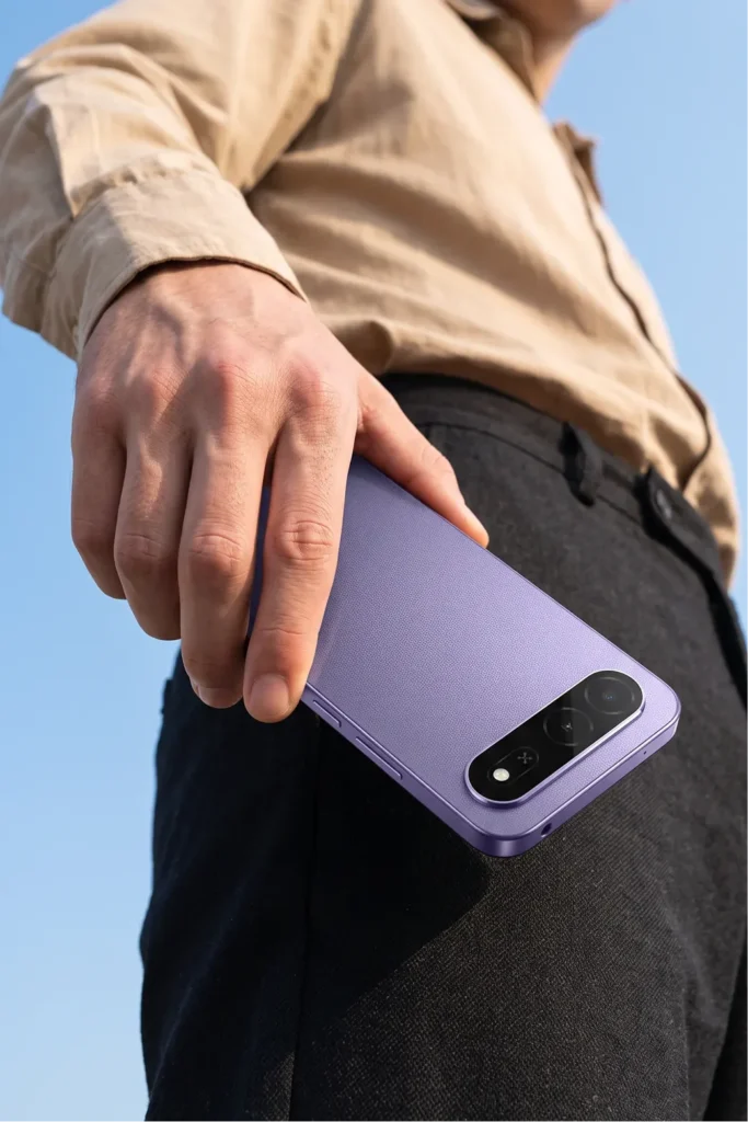itel City 300 5G, held at the hip outdoors, from the back