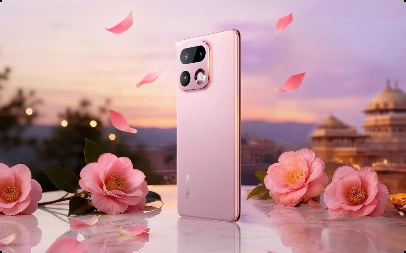 realme 16 Pro+ 5G in pink standing on a marble table with flowers and a palace at dusk behind