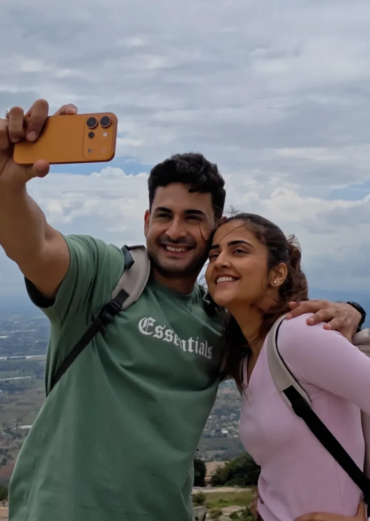 Vivo V80, held up for a selfie by two people outdoors